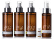 Four brown spray bottles labeled "Esse" (sensitive mist, biome mist, hydrating mist, and live probiotic mist) are lined up side by side, with a small clear vial in front of the third bottle, against a white background.